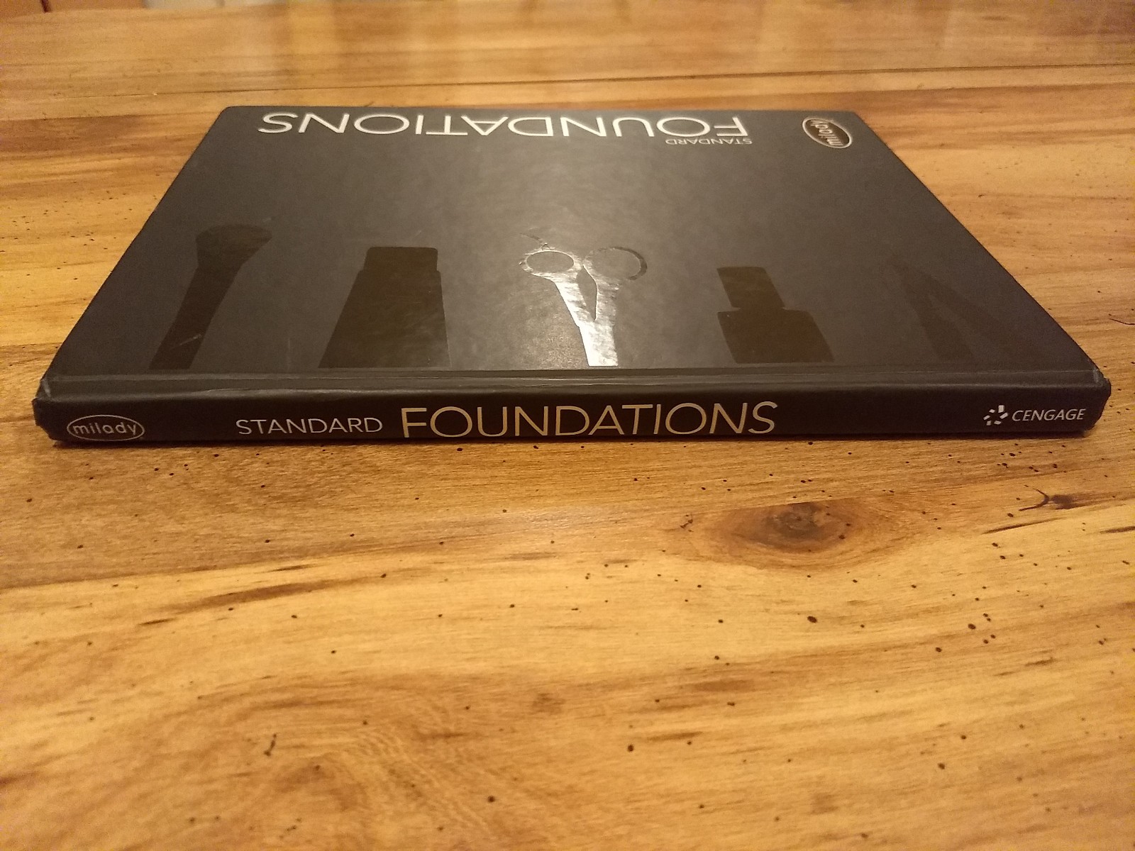 Milady Standard Foundations by Milady Cengage Learning Hardcover text book